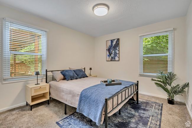Carpeted bedroom featuring baseboards | Image 10