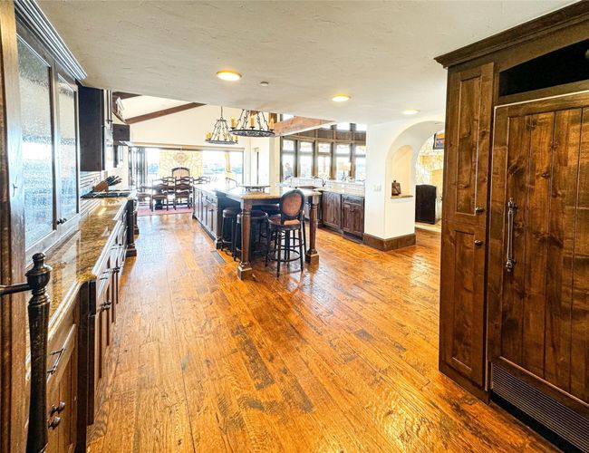 Chef's kitchen with dual dishwashers, sinks, refrigerators, microwaves, Wolf dual oven, NanaWall doors and more | Image 15