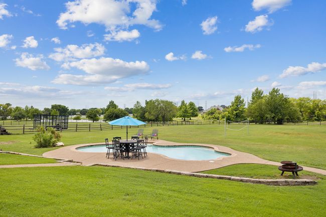 View of pool featuring a patio and an outdoor fire pit | Image 36