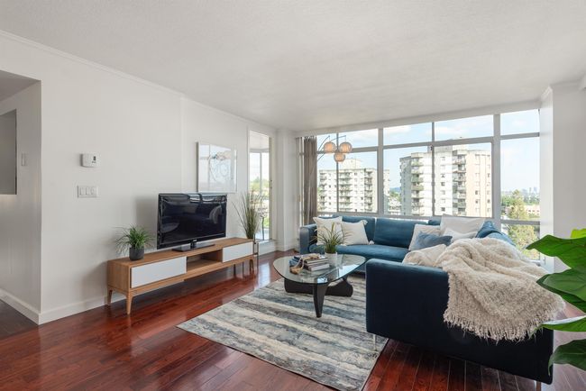 Living area featuring wood-type flooring, a wall of windows, and ornamental molding | Image 10