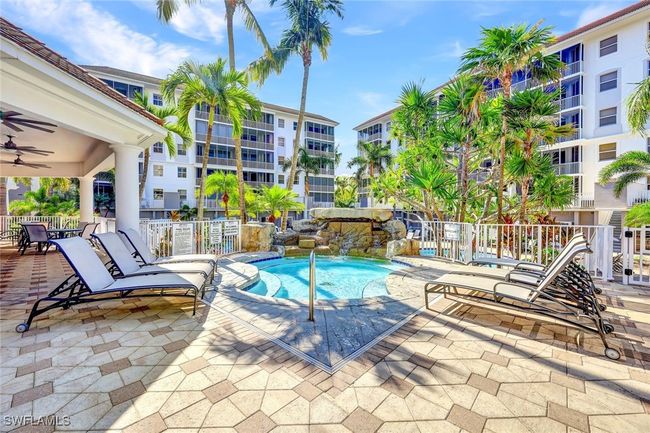 Community pool featuring fence, a patio, and ceiling fan | Image 22
