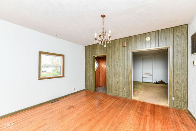 Hardwood floors and chandelier connected to living room | Image 5