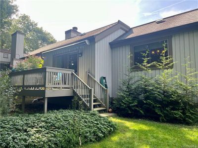 Rear view of property featuring a deck | Image 2