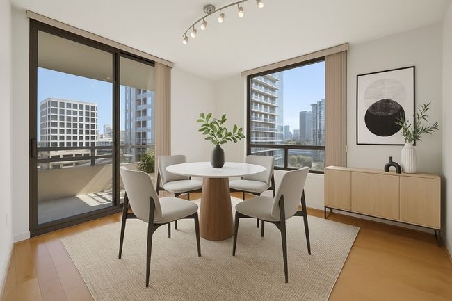 Virtual Staging - Dining space with a view of city, floor to ceiling windows, and light wood-type flooring | Image 12