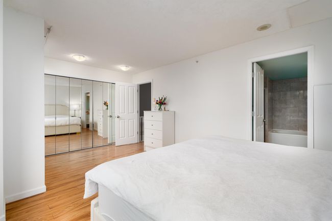 Bedroom featuring light wood-style floors | Image 12