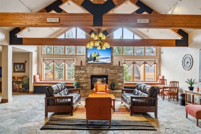 Welcoming main lobby with a fireplace and sitting areas. | Image 12