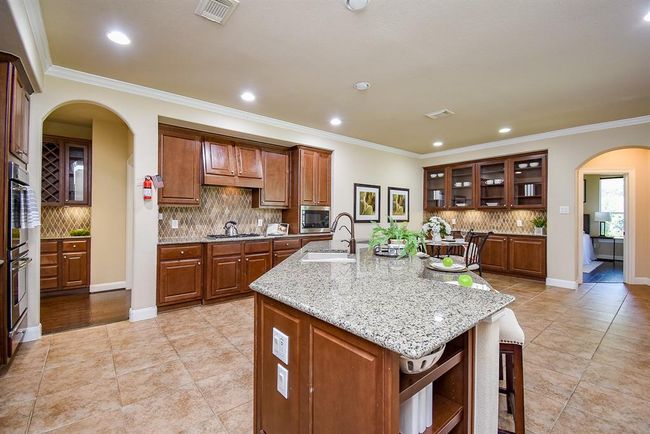 7003 Paxton Ct, House other with 5 bedrooms, 4 bathrooms and 3 parking in Sugar Land TX | Image 15