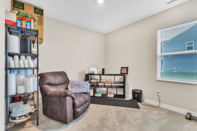 living area with visible vents, baseboards, carpet flooring, and plenty of natural light | Image 14