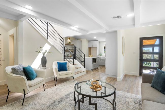The living room has plenty of space for hosting family and friends. | Image 9