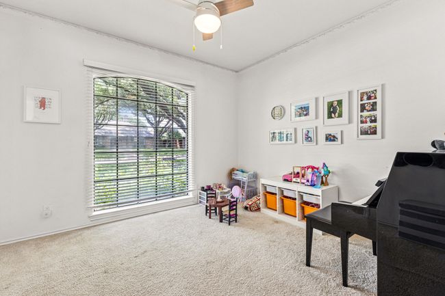 Recreation room featuring carpet flooring and a ceiling fan | Image 21