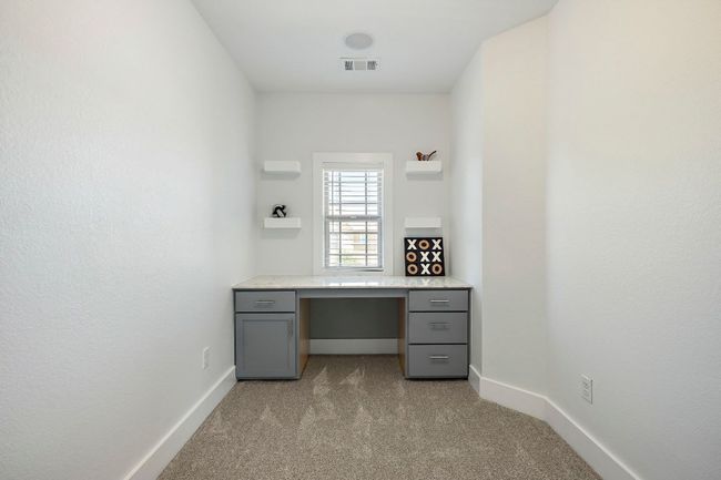 Unfurnished office with baseboards, visible vents, and light colored carpet | Image 24