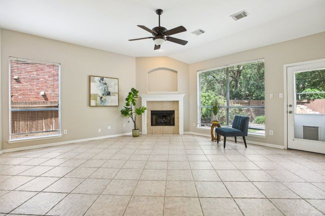 Seamless flow between living, dining, and kitchen areas creates a connected and functional layout. | Image 5