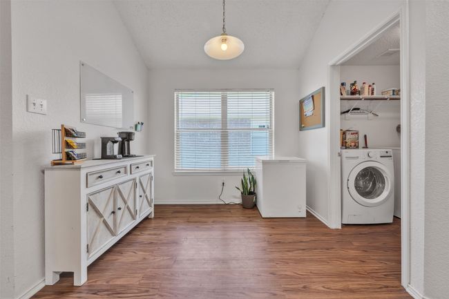 Breakfast area with wood finished floors and a textured ceiling | Image 6