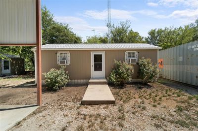 Back of house with cooling unit | Image 1