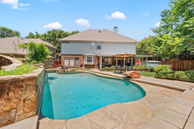 View of the backyard looking towards the back of the home. This stunning backyard definitely offers tons of "wow factor"! | Image 8