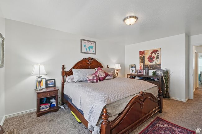 Carpeted bedroom featuring baseboards | Image 21