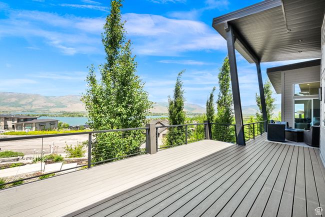 Deck with a water and mountain view | Image 84