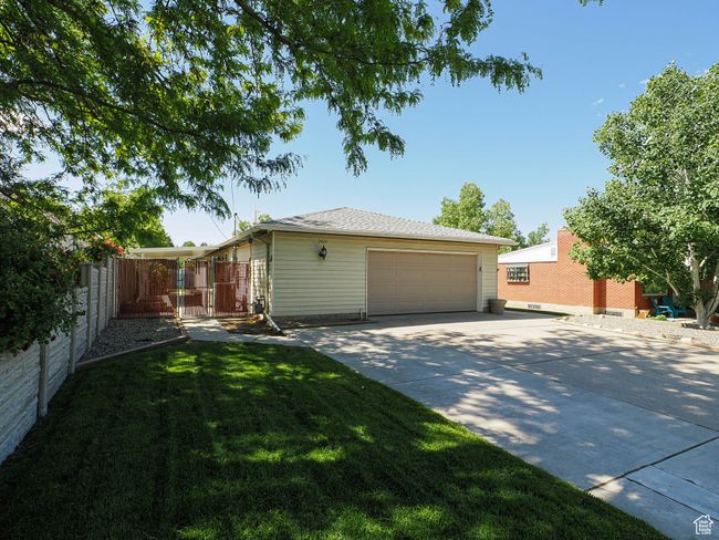 View of side of home featuring a garage and driveway | Image 39