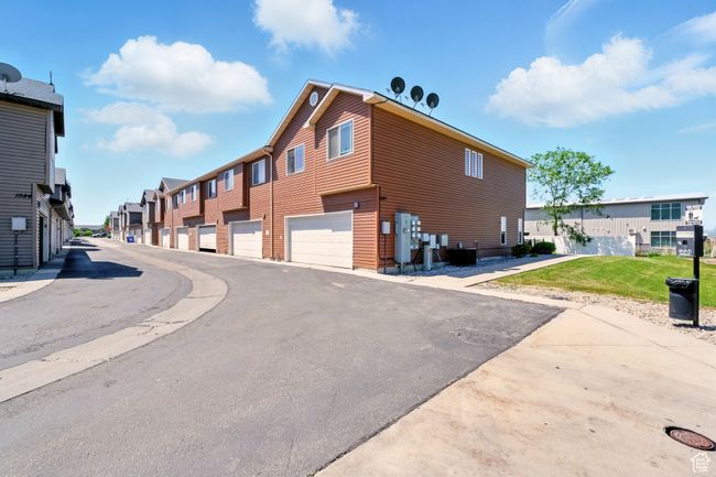 View of asphalt street with a residential view | Image 28