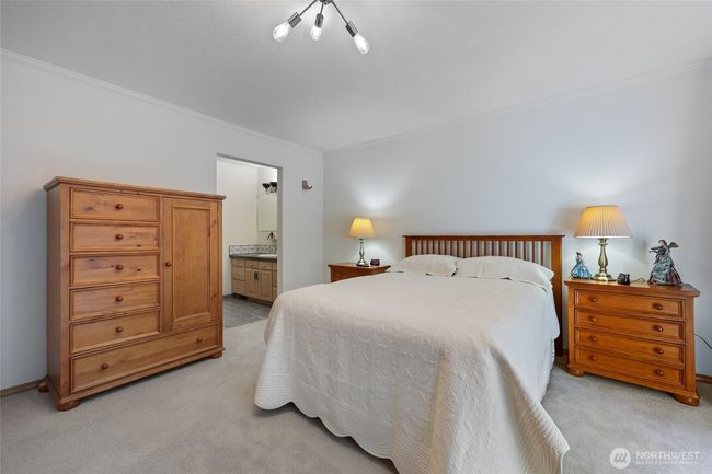 Another view of primary bedroom leading into ensuite. All bedrooms have new carpet. | Image 26
