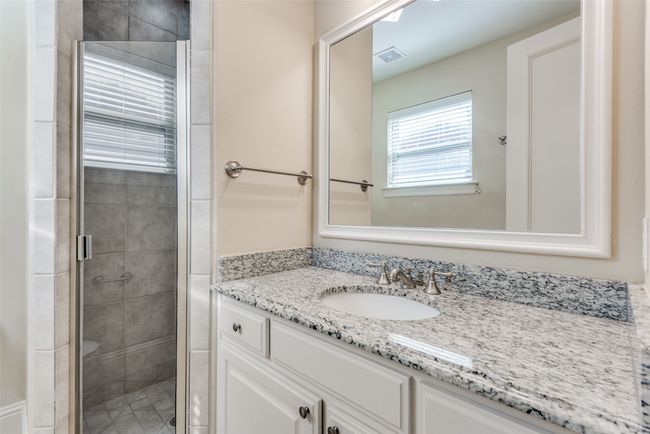 Bathroom featuring vanity and a stall shower | Image 7