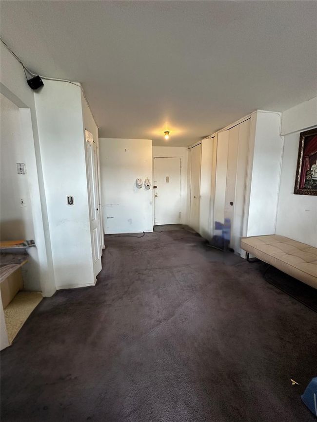 View of living room and apt. entrance | Image 11