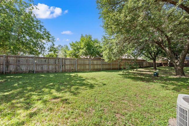 View of fenced backyard | Image 18