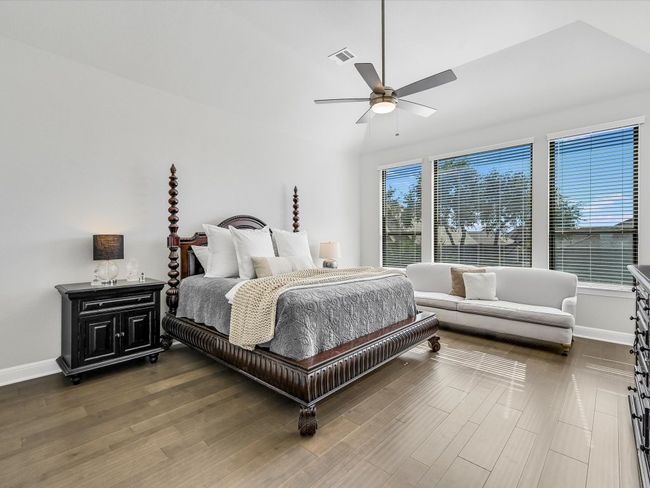 Bedroom featuring wood finished floors and a ceiling fan | Image 22