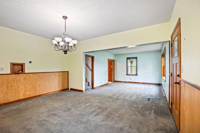 The last door on the left is a main floor bedroom. | Image 9