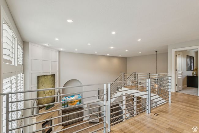 Corridor with an upstairs landing, recessed lighting, and wood finished floors | Image 37