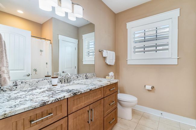 Full bathroom with baseboards, toilet, vanity, and a wealth of natural light | Image 20