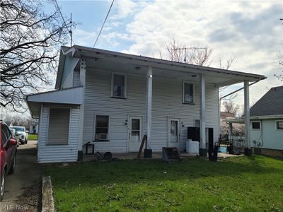 Rear view of house with a yard | Image 2