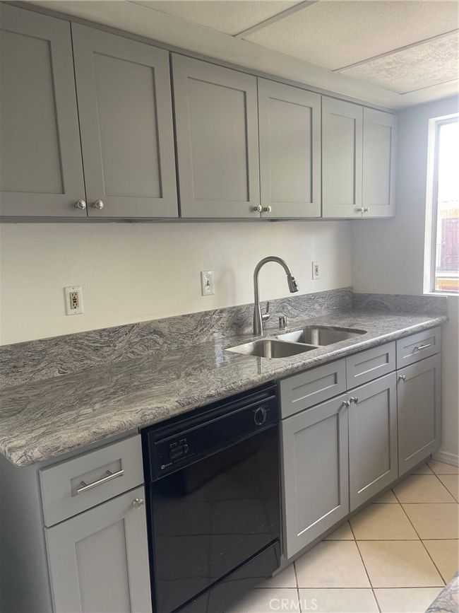 Kitchen with dishwasher and sink | Image 5