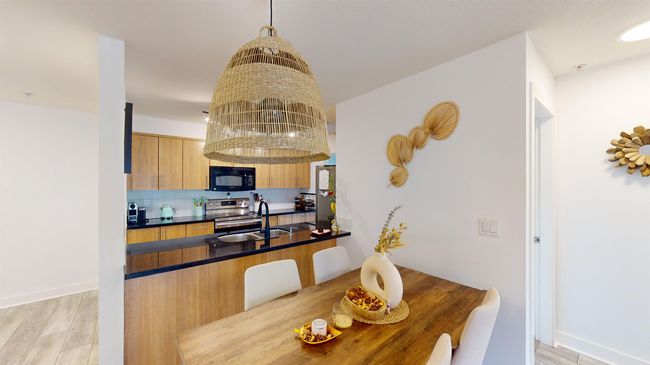 Dining area with light wood-type flooring and baseboards | Image 7