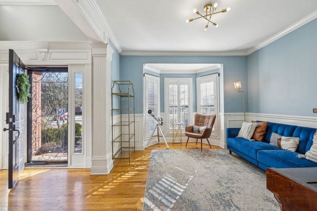 To the left of the front door is this wonderful multipurpose room. It could be a music room, home school room, library or formal dining room. | Image 8