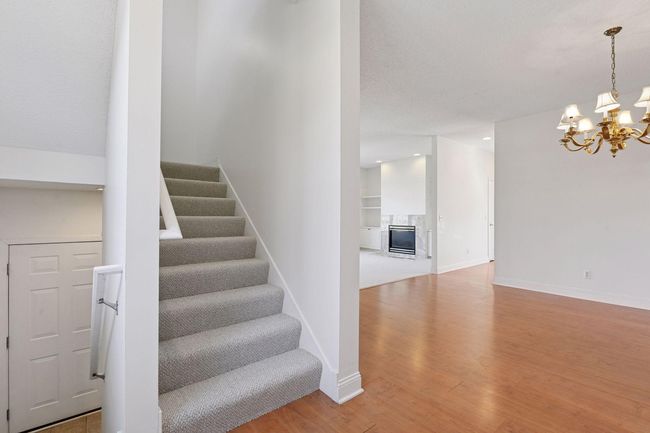 carpeted stairs to upper level | Image 25