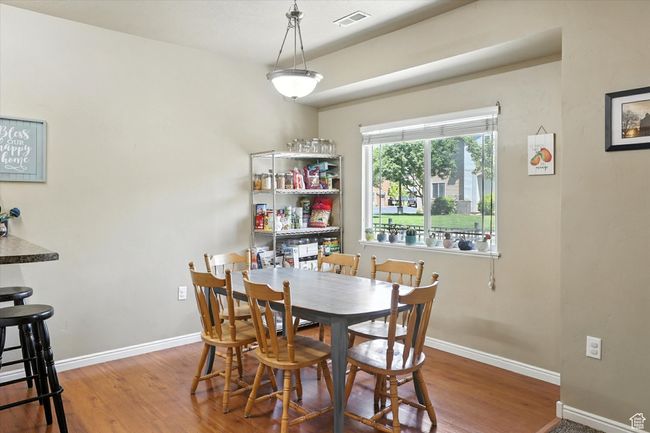 Dining room with wood finished floors | Image 8