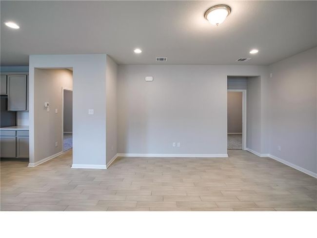 Unfurnished room featuring light wood-style floors and recessed lighting | Image 7
