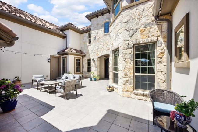 View of patio with an outdoor living space | Image 5