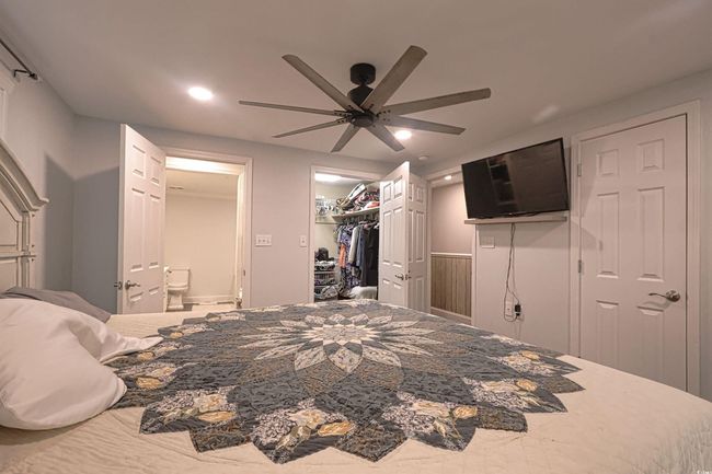 Bedroom with recessed lighting, ensuite bathroom, a ceiling fan, a spacious closet, and a closet | Image 19