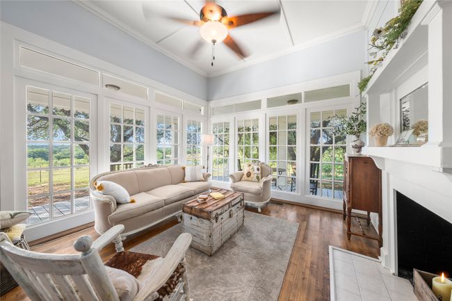 Sunroom with french doors, hardwood / wood-style flooring, and ornamental molding | Image 14