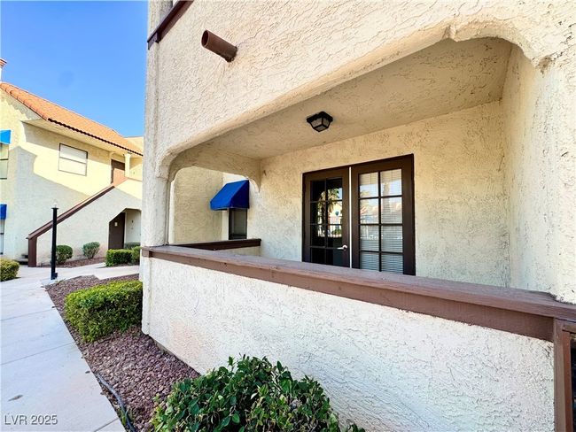 Doorway to property with stucco siding | Image 6