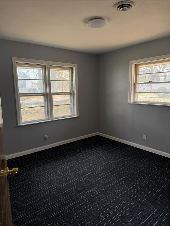Unfurnished room with a wealth of natural light, baseboards, and visible vents | Image 14