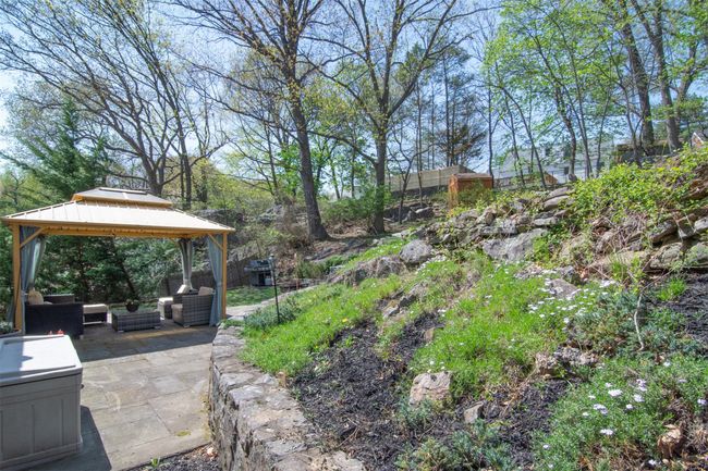 View of yard featuring an outdoor living space, a gazebo, and a patio area | Image 21