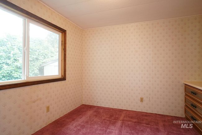 Empty room with dark colored carpet | Image 5