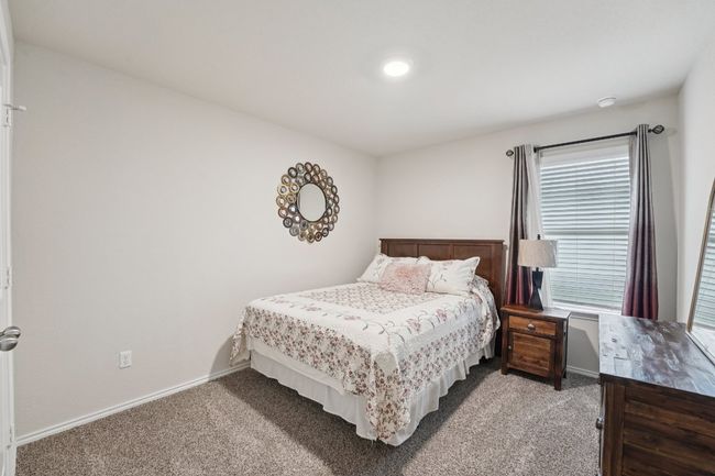 Carpeted bedroom featuring baseboards | Image 21