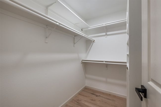 Walk in closet with wood finished floors | Image 22