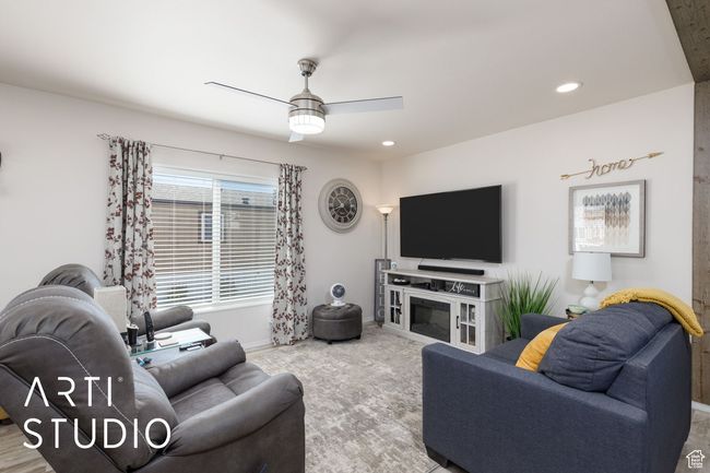 Living room with a ceiling fan and recessed lighting | Image 7