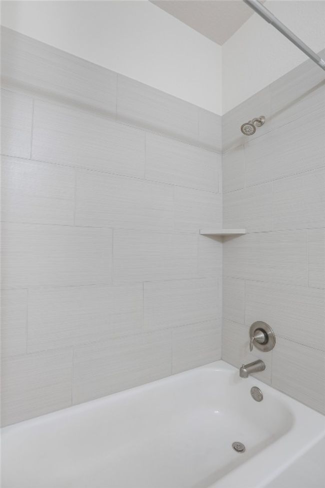 Full bathroom featuring shower / bathtub combination | Image 25