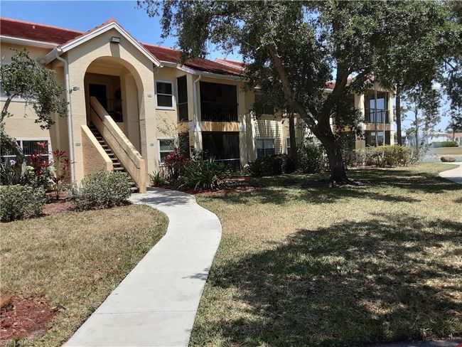 View of property's community featuring a lawn and stairway | Image 4